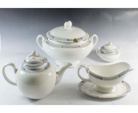A Royal Worcester "Beaufort" dinner service comprising: ten dinner plates, six soup plates, eight cheese plates, eight tea pl