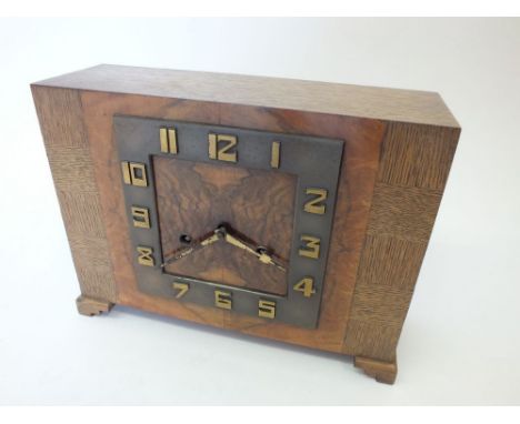 An oak Art Deco mantel clock with striking movement, 22cm x 29cm 