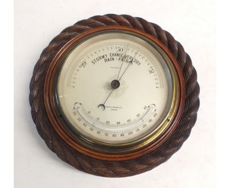 A Stuart &amp; Mason circular barometer with  carved rope design surround 