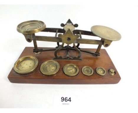 A set of brass and mahogany postage scales and weights stamped Browne &amp; Nolan, Dublin 