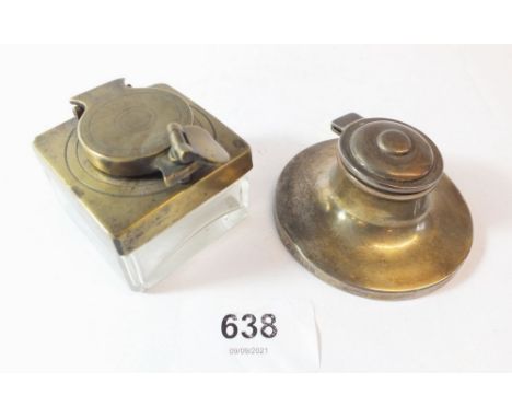 A silver inkwell and a brass travelling inkwell 