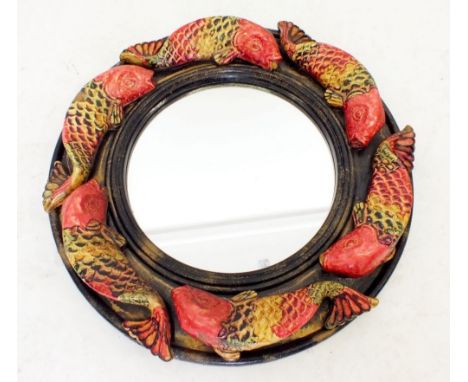 A decorative circular mirror with moulded fish border, 48cm diameter