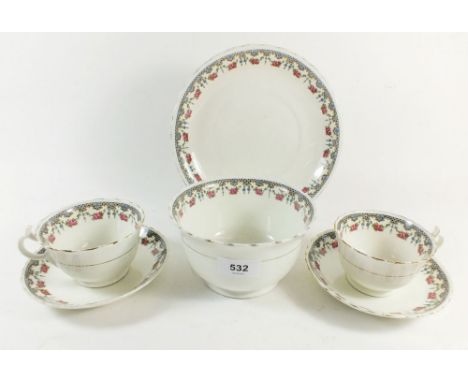 An Edwardian tea service with garland decoration comprising ten cups and saucers, two coffee cups, eight tea plates, a sugar 