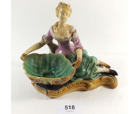 An early Victorian Minton Majolica figure of a woman with basket, unmarked, restored 