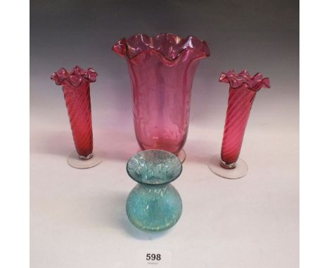 A Victorian cranberry glass vase with etched decoration and a pair of Victorian cranberry glass frill top and blue lustre  va