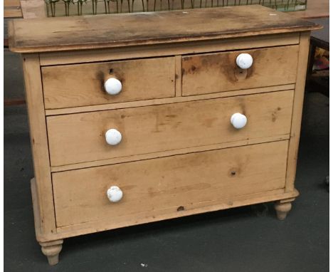 A late 19th/early 20th pine chest of two long over two short drawers, ceramic knobs (one missing), 103x46x79cmH 