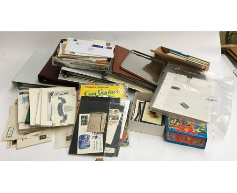 A mixed lot of various postcards, stamps, first day covers, Star Wars Tazos etc 