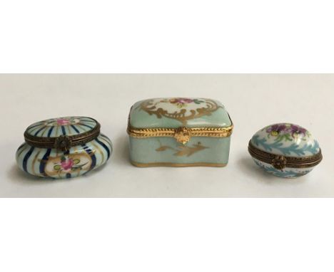 A set of three Limoges trinket boxes, light blue with floral design, marked to base 