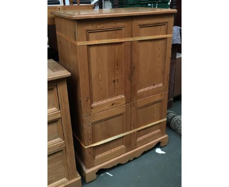 A pine cupboard, four doors on bracket feet, 97x56x144cmH 