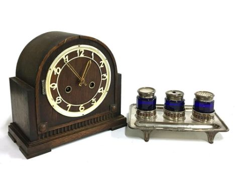A Mantel clock, plaque to reverse reading W. Pellant &amp; Son, Harpenden; together with a plated inkstand with three blue gl