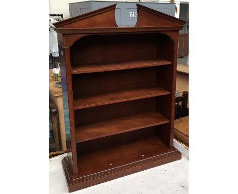 A pine bookshelf with three shelves, 123x100cm; together with a small shelf with broken pediment, 52x70cm 