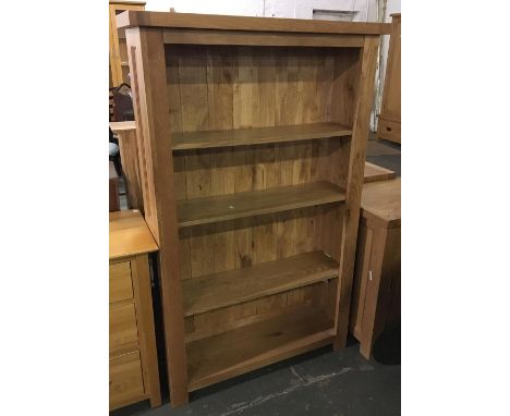 A contemporary oak bookshelf of four shelves, 97x30x155cm; together with a smaller shelf of six shelves, 37x112cmH 