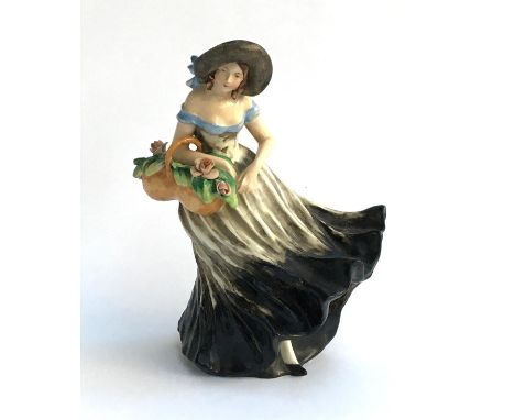 A continental ceramic figurine of a girl 