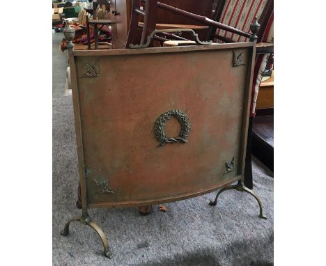 A brass fire screen, with applied wreath decoration, 62cmH 