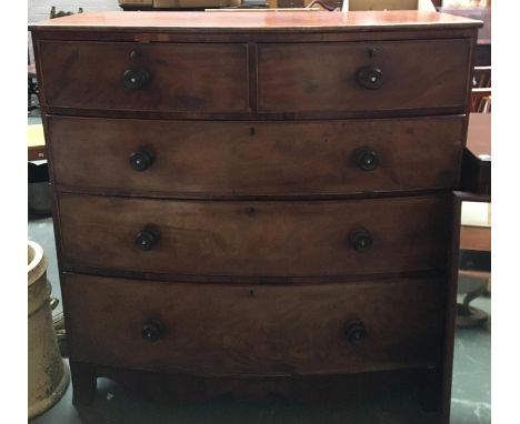 A 19th century mahogany bowfront chest of two short over three graduating drawers, on bracket feet with shaped apron, with ke