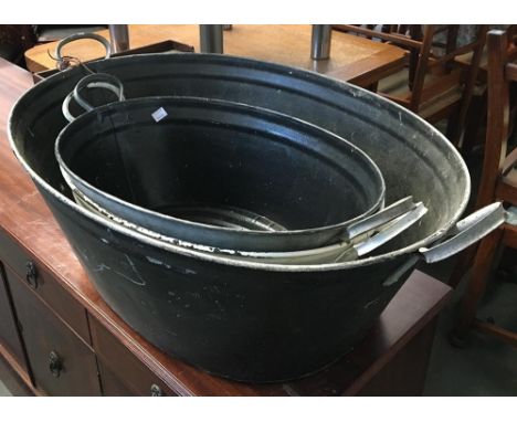 One large and two smaller galvanised vintage wash pans, approx. 88cmL and 62cmL