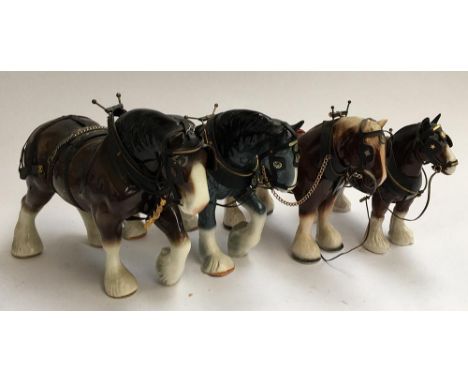 Four ceramic shire horses 