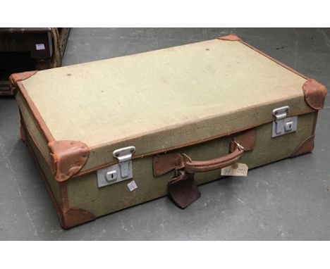 A vintage canvas suitcase with leather corner and trim, 68cmW 