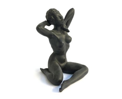 A Gilbert Carradine black bisque nude female figure, signed to base, c.1950, 27cmH 