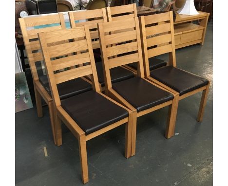 A set of six light oak and vinyl dining chairs 