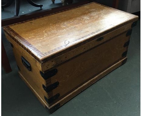 A vintage pine blanket box with metal bracings and loop handles, 83x46x44cm 