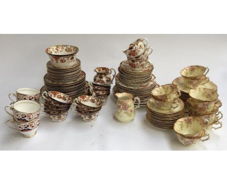 A part tea service, heightened in gilt; together with another with floral design, marked 'W Sons'; and four Royal Grafton tea