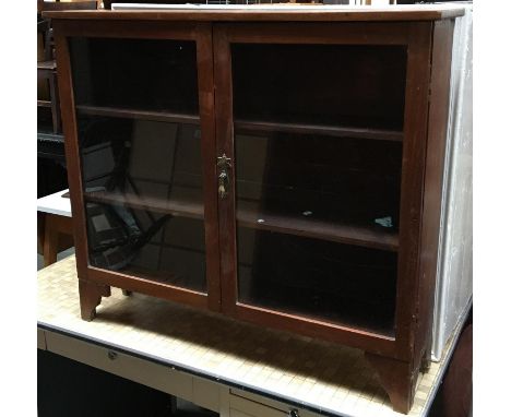 A small glazed mahogany bookcase of three shelves, on bracket feet, 90x21x78cmH 