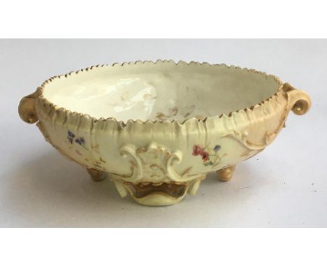 A Royal Worcester hand painted blush ivory ornate footed bowl, with floral decoration heightened in gilt, interior paintwork 