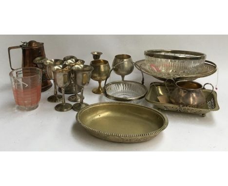A mixed lot of plated wares, goblets, copper art nouveau jug, candlestick etc 