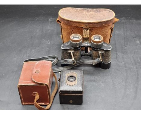 A pair of Carl Zeiss Delturis 8x24 binoculars, in tan leather case; together with a Baby Box camera, in case. (2) 