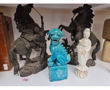 A Chinese blanc de chine figure of Guanyin, 25.5cm high; together with a Chinese turquoise ceramic temple dog; and a pair of 