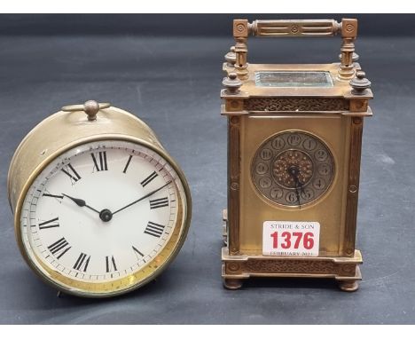A gilt brass carriage timepiece, height including handle 15cm, with key; together with another brass timepiece, with 3 1/2in 
