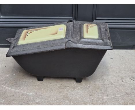 An old cast iron and enamel coal box. 