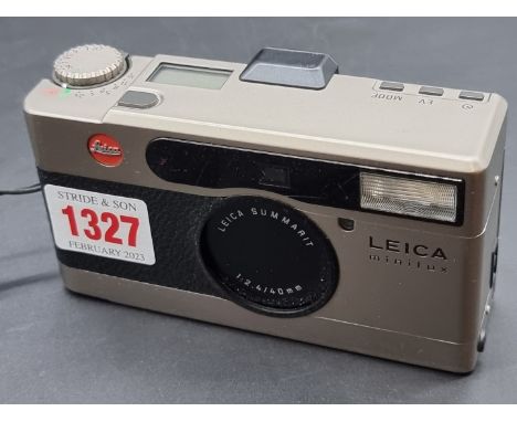Camera: a Leica Minilux film camera, with leather case. 