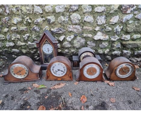 Five various oak mantel clocks; together with one other mantel clock. 