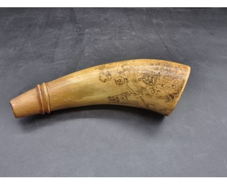 A scrimshaw style horn powder flask, 17th/18th century, engraved with The Royal Standard, 20cm long. 