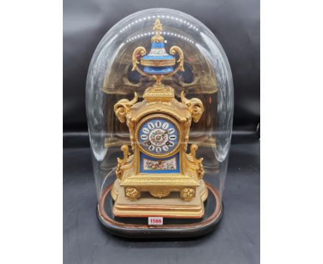 A late 19th century Louis XVI style, gilt metal and Sevres mounted mantel clock, 36cm high, with pendulum, on giltwood stand,