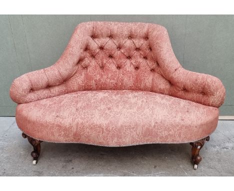 A small Victorian walnut and button upholstered settee, 135cm wide. 