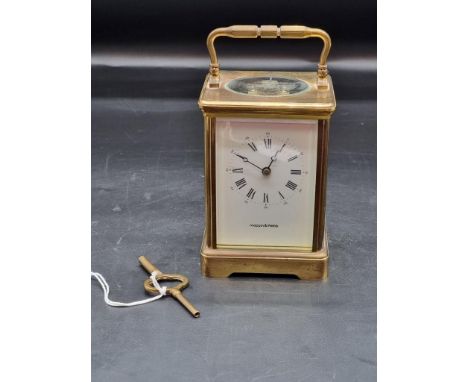 An old brass carriage clock, by Mappin &amp; Webb, striking on a gong, height including handle 17.5cm, with winding key. 