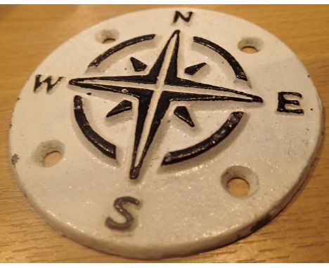 Circular cast iron compass points sign, D: 9 cm. P&amp;P Group 1 (£14+VAT for the first lot and £1+VAT for subsequent lots) 
