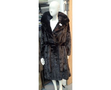 Ladies 3/4 length black mink fully lined fur coat with belt and buttons, monogrammed GW in gold stitching. Condition report: 
