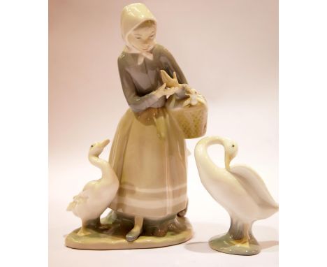 Lladro girl with geese and a Lladro goose. P&amp;P Group 2 (£18+VAT for the first lot and £2+VAT for subsequent lots) 
