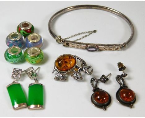 A pair of white metal mounted Chinese jade earrings, a pair of amber earrings, five .925 marked beads, a silver bangle &amp; 