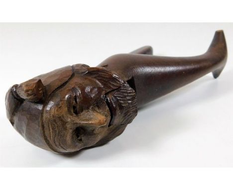 An antique Victorian carved nutcracker of old man in nightcap 8in long