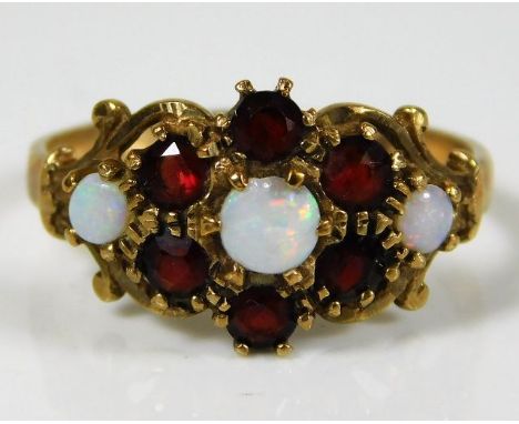 A 9ct gold ring set with garnet &amp; opal 2.1g size L/M