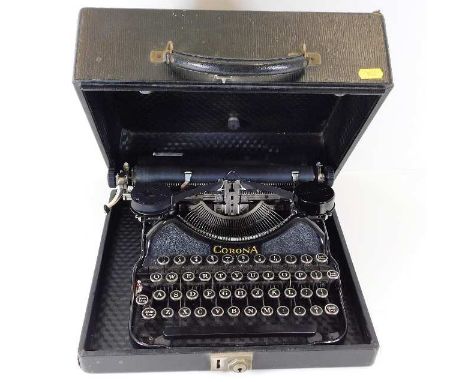 A vintage Corona typewriter with carry case