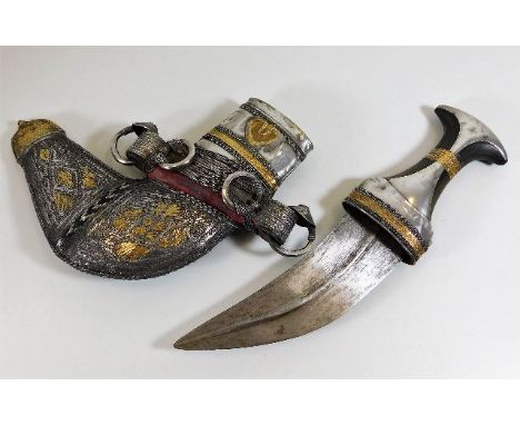 An Arab white metal mounted Islamic Jambiya dagger with decorative scabbard