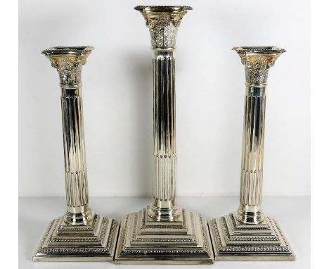 A modern corinthian column silver candlestick garniture by W. I. Broadway &amp; Co. 1950g inclusive centre being approx. 12in