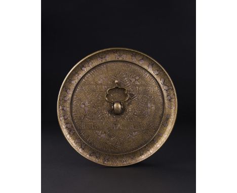 A CALLIGRAPHIC INSCRIBED SELJUK BRONZE CIRCULAR MIRROR, PERSIA, 12TH CENTURY            Diameter: 27.5cm              Provena
