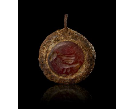 IRON PENDANT WITH INTAGLIO DEPICTING A BIRD, 3RD - 4TH CENTURY A.D. H: 2.8cm  